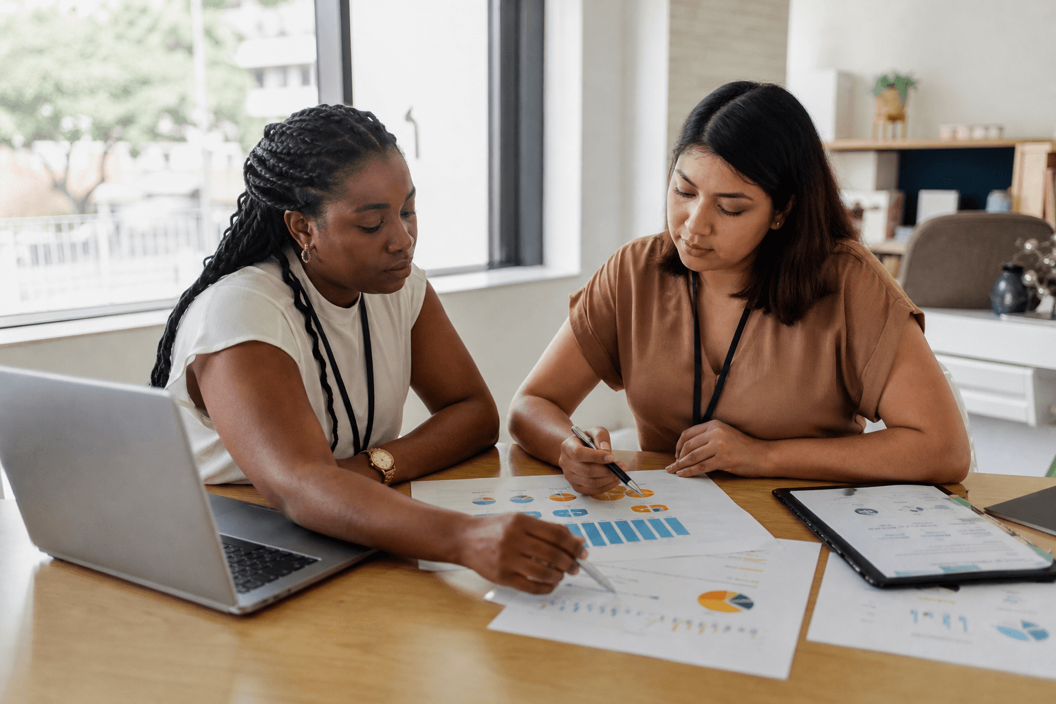 Nonprofit program staff reviewing participant survey results together