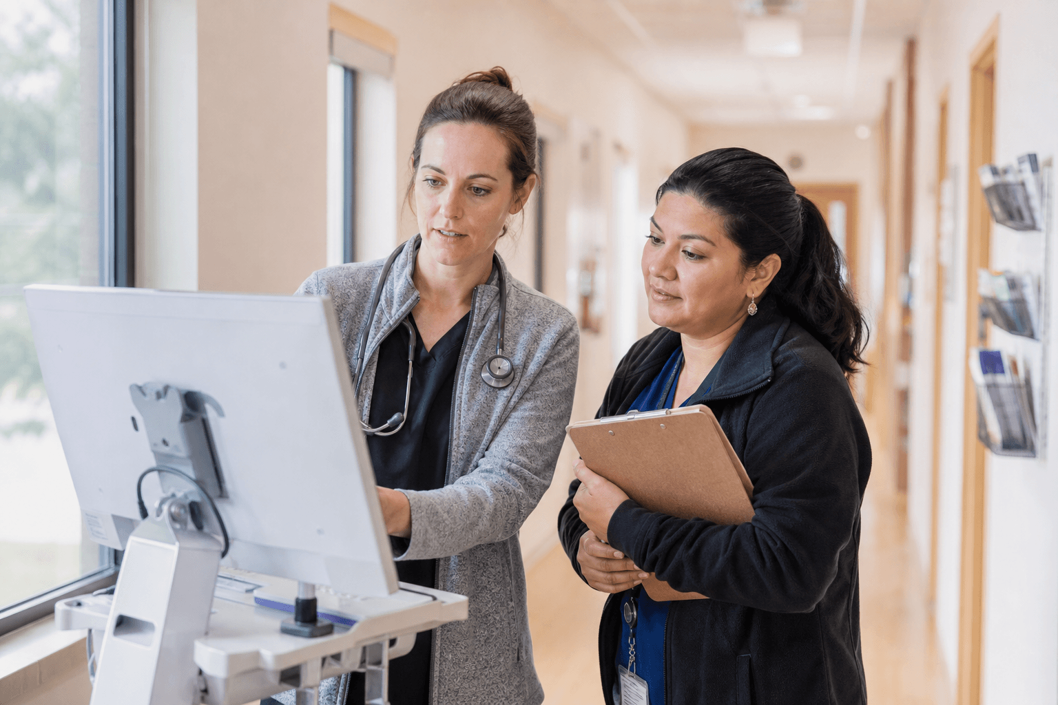 Community health clinic care team reviewing patient panel information